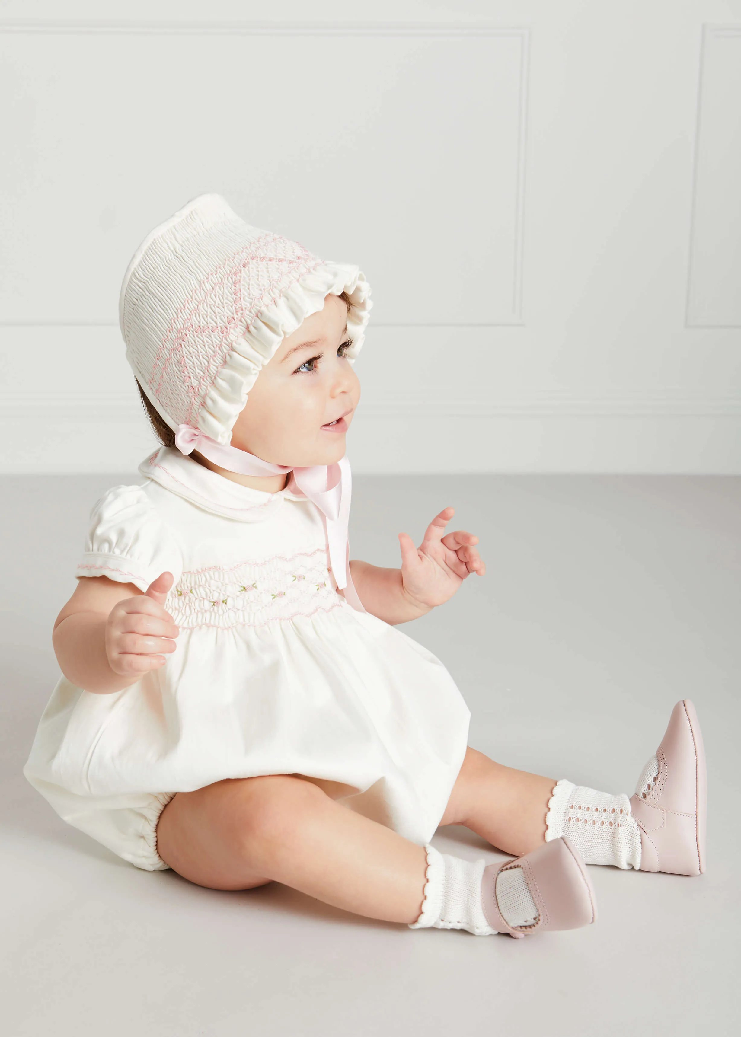 Classic Off-White Pink Handsmocked Romper (3-18mths)